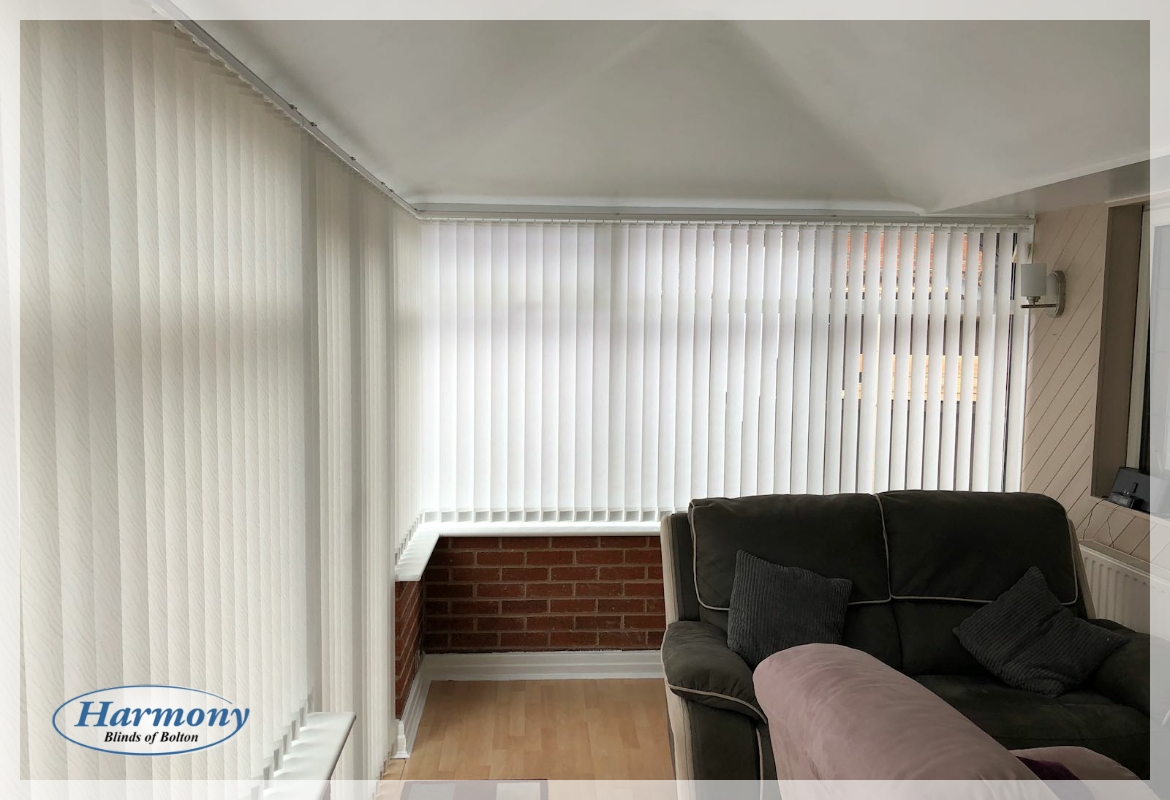 White Textured Vertical Blinds in a Conservatory